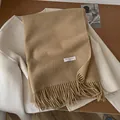 Elegant camel wool scarf with fringe and vintage woven label on white coat - 195x65cm / Khaki