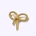 Elegant gold bow brooch with twisted rope texture and polished metallic finish - Gold