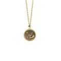 Close-up of Taurus zodiac relief on dark mother of pearl pendant with gold beaded frame - Capricorn + Gray Mother of Pearl
