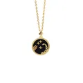 Detailed close-up of golden Scorpio necklace with black starry base and intricate engraving - Scorpio + Black Mother of Pearl