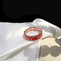 Macro shot of S925 sterling silver ring with rectangular red zircon inlay and S925 stamp - US 6 / Red Zircon