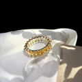 Macro shot of silver ring with full eternity band of emerald-cut yellow zircons - US 6 / Yellow Zircon