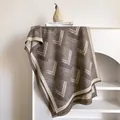 Close-up of geometric cashmere-feel scarf with herringbone pattern and tassel fringes - 185x65cm / Dark Khaki
