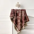 Macro detail of tropical floral jacquard cashmere scarf with houndstooth edges and fringes - Coffee
