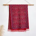 Ethnic paisley pattern shawl in deep red with tassel fringe detail on a wooden hanger - 200x65cm / Red (BXS-383)