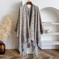 Bohemian paisley jacquard poncho with elegant long fringe tassels shown on a wooden hanger - 145x130cm / Khaki (BXS-461)