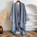 Detail of blue paisley floral shawl with long fringe tassels on a wooden hanger - Tops / 145x130cm / Blue (BXS-436)
