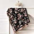 Close-up of ethnic floral jacquard scarf with fine fringe details and contrast colors - 185x65cm / Black