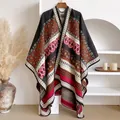 Detail of bohemian thick shawl wrap with paisley patterns and geometric knit texture - Black
