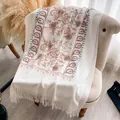 Beige cashmere-feel scarf with floral embroidery and bohemian tassels on a sofa - Cx-064 White / 200x70cm