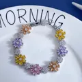 Detailed macro view of colorful zircon flower bracelet with pink and purple stones - Colorful