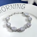 Elegant silver zircon bracelet featuring large oval gems with pavé floral accents - Clear White