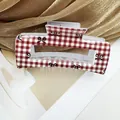 Pinza per capelli a scacchi bianchi e rossi con fiocchi neri e finitura lucida - Modello Quadrato Sei
