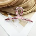 Elegante pinza per capelli a quadretti bianchi e rossi con motivi a fiocco nero - Modello Incrocio Sei