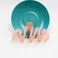 Dettaglio della molletta per capelli a onde in acrilico rosa-arancio traslucido - Arancione Gelatina