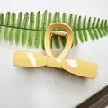 Elegant mustard yellow bow-shaped hair claw clip with a glossy finish for thick hair - Bowknot-Orange Yellow
