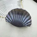 Sparkling dark grey shell-shaped hair claw with iridescent resin finish for beach wear - Ink Grey