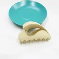 Matte beige hollow claw clip for women's hair styling in minimalist stream design - Milk Tea