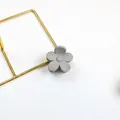 Matte grey flower hair claw clip with minimalist five-petal design on white background - Light Gray