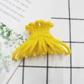 Matte finish bright yellow hair claw clip with unique wavy design for firm hair styling - Yellow