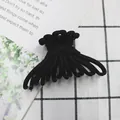 Matte black claw clip with a unique twisted ribbon design and frosted resin finish - Black
