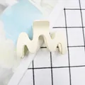 Chic beige matte claw clip in M-shape wavy design for elegant hair styling - White