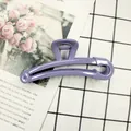 Detail of lavender safety pin hair claw clip with strong metal spring on desk - Lavender