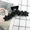 Glossy black star-shaped hair claw clip with cutout pentagon design for women - Black