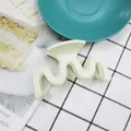Elegant cream white matte wave-shaped hair claw clip for a minimalist high ponytail look - White