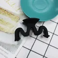 Matte black wave M-shape hair claw clip with minimalist textured finish for women - Black