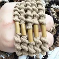Detail of multi-colored spiral elastic hair ties worn on hand as stylish bracelets - Light Coffee