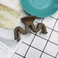 Matte dark brown wave hair claw clip for high ponytail styling on a textured grid background - Dark Coffee