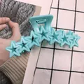 Star-shaped hair claw clip in pastel macaron blue with shiny hollow pentagon design - Lake Blue