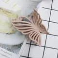 Matte milk tea color large butterfly hair claw clip with hollow resin design for women - Nude