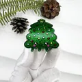 Détail d'une pince à cheveux sapin de Noël pailletée avec visage mignon et étoile - Sapin de Noël