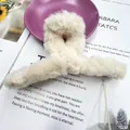 Plush cream white faux fur claw clip for women in a winter minimalist style - Milky White
