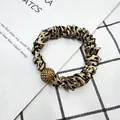 Haargummi aus Satin mit Leopardenmuster und goldenem Strassball als Anhänger - Leopardenmuster mit Goldener Perle