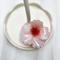 Elegante pinza per capelli a fiore in resina rosa sfumata su supporto in ceramica - Rosso Acqua