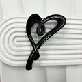 Glossy black heart-shaped hair claw clip with a minimalist sleek resin finish - Bright Black