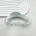 Detailed macro shot of a clear cloud-shaped hair claw clip with a sleek acrylic finish - Gradient White