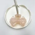 Pince à cheveux nœud rose translucide sur plateau en céramique blanche élégante - Orange Transparent Nœud Papillon