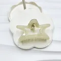 Star-shaped pearlescent cream white hair claw clip with bow-inspired elegant design - Light Yellow Star