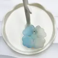 Cute blue and white gradient flower hair claw clip with matte finish on display - Blue and Yellow