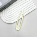 Minimalistische cremeweiße U-förmige Haarnadel aus glattem Acetat für elegantes Styling - Creme