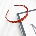 Cerchietto a fiori arancione opaco per donna con design interno antiscivolo - Arancione