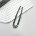 Elegant U-shaped hair fork in deep grey finish for secure and stylish hair styling - Gray