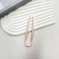 Elegant U-shaped hairpin in glossy pale pink finish on a decorative white background - Light Pink
