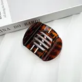 Flat round tortoiseshell hair claw clip in dark brown leopard print for women - Glossy Leopard