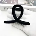 Elegant black flocked shark hair claw clip with a minimalist circular ring design - Twisted Bowknot Shape (Style 9) / Black
