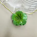 Pinza per capelli a fiore verde traslucido con dettagli di petali misura 4 cm - Verde